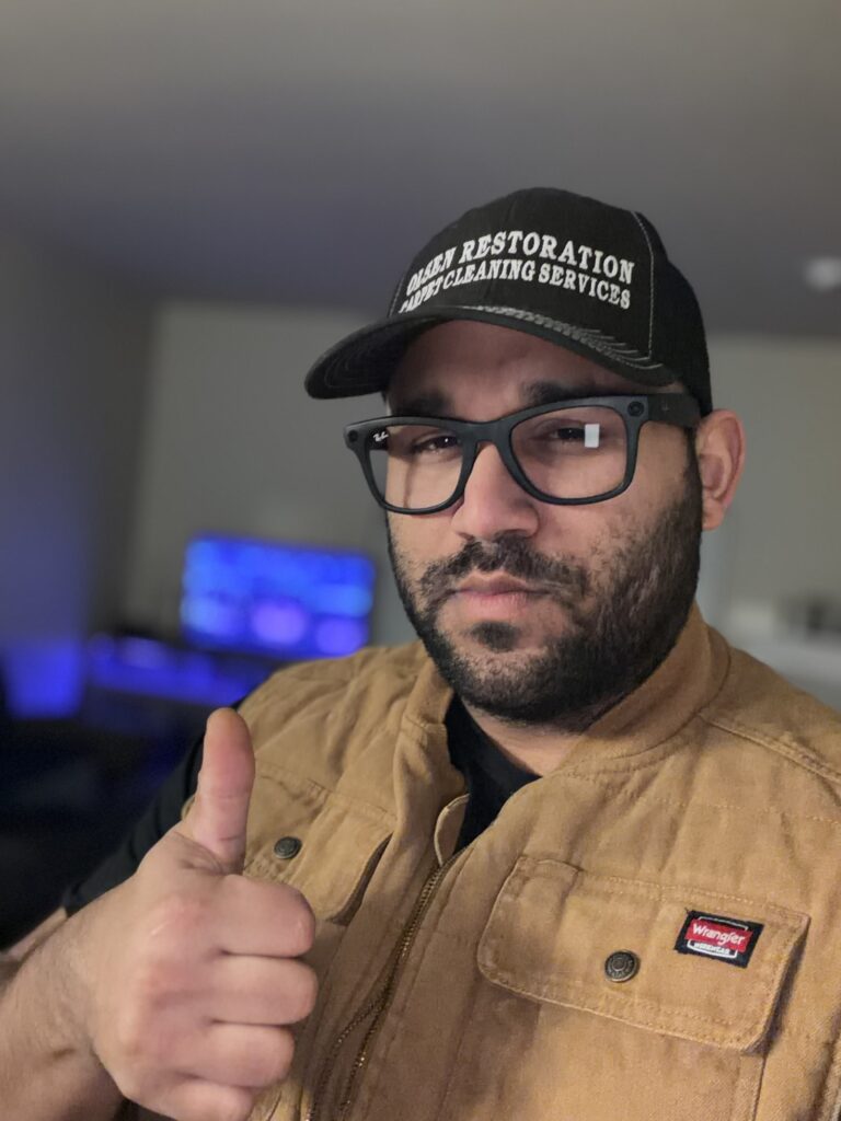 Olsen Restoration founder giving thumbs up