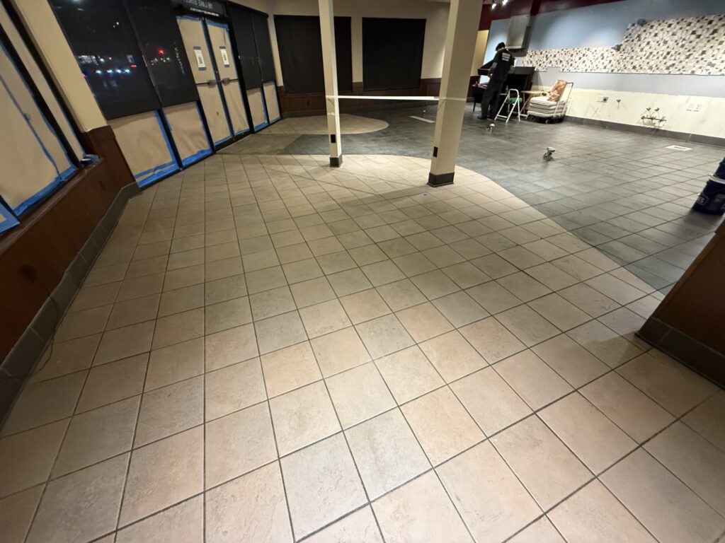 Professional commercial tile and grout cleaning for a restaurant or retail space by Olsen Restoration.