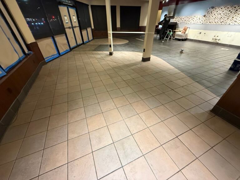 Large commercial room with a tiled floor and grout lines