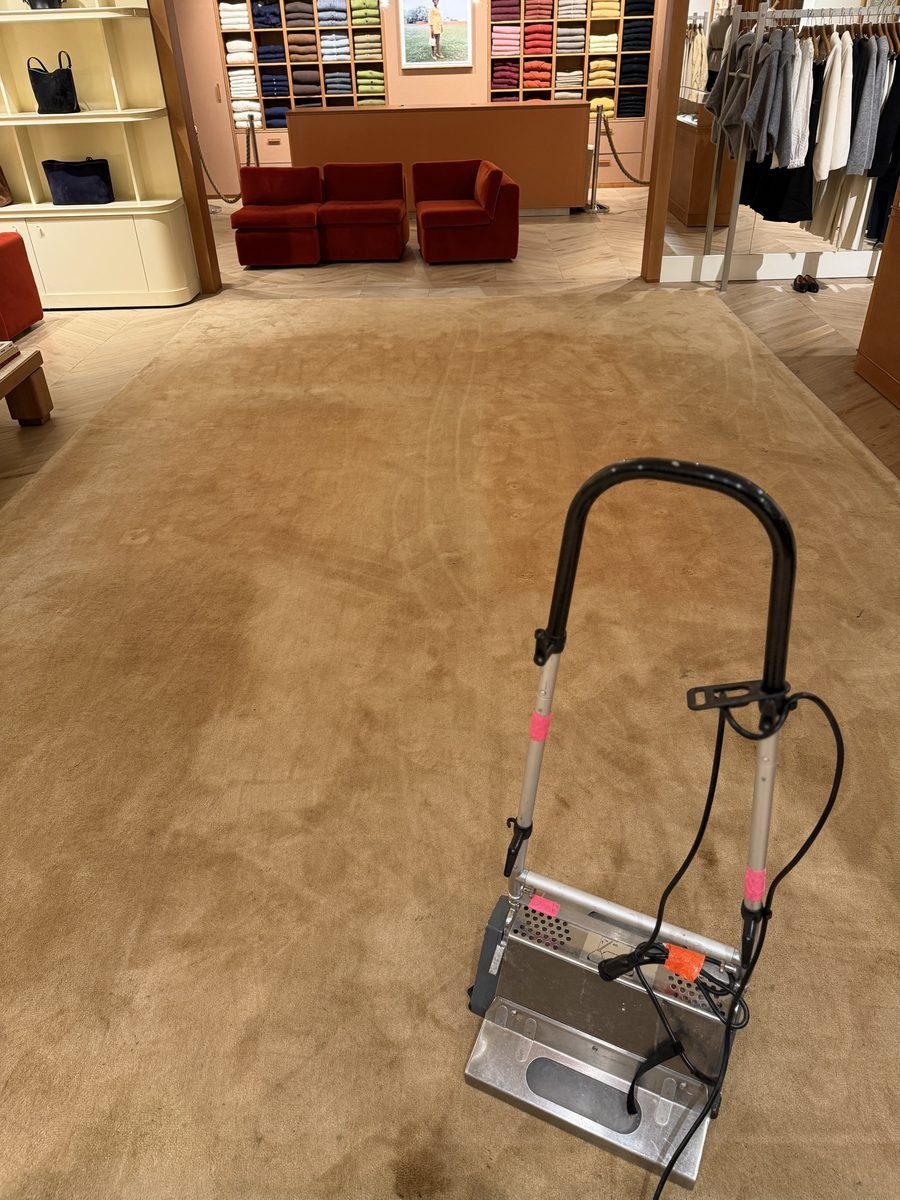 Large retail store rug during professional cleaning